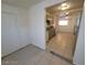 Galley kitchen featuring gray cabinets, tile floors, and stainless steel appliances at 2564 San Marcos St, Las Vegas, NV 89115
