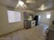 Eat in kitchen featuring granite countertops, gray cabinets and appliances at 2564 San Marcos St, Las Vegas, NV 89115
