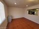 Living room with tile floors connects seamlessly to the adjacent kitchen at 2564 San Marcos St, Las Vegas, NV 89115