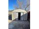 Storage shed with double doors and concrete pad in the backyard at 2564 San Marcos St, Las Vegas, NV 89115