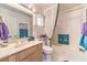 Bathroom with single vanity, mirror, and tub with shower and decorative curtain at 2608 Golfside Dr, Las Vegas, NV 89134