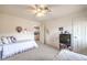 Guest bedroom with two twin beds, ceiling fan, and doorway to another room at 2608 Golfside Dr, Las Vegas, NV 89134
