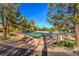 Bocce ball court nestled among mature trees and landscaping with available seating at 2608 Golfside Dr, Las Vegas, NV 89134