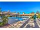 Community pool area surrounded by palm trees and lounge chairs at 2608 Golfside Dr, Las Vegas, NV 89134