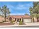 Charming single-story home featuring a well-manicured front yard, desert landscaping, and a two-car garage at 2608 Golfside Dr, Las Vegas, NV 89134