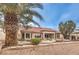 Charming home featuring a tile roof, manicured landscaping, and a welcoming exterior at 2608 Golfside Dr, Las Vegas, NV 89134