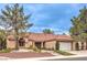 Charming single-story home featuring a well-manicured front yard, desert landscaping, and a two-car garage at 2608 Golfside Dr, Las Vegas, NV 89134