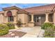 Inviting front entrance with landscaped accents, stone pathway, portico with columns, and a stylish front door at 2608 Golfside Dr, Las Vegas, NV 89134