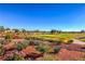 Scenic view of the lush green golf course with mature landscaping and tranquil water features at 2608 Golfside Dr, Las Vegas, NV 89134