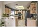 Functional kitchen featuring light wood cabinetry, stainless steel appliances, and ample counter space at 2608 Golfside Dr, Las Vegas, NV 89134