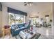 Bright living room boasting large windows with views, comfortable seating, and tile floors at 2608 Golfside Dr, Las Vegas, NV 89134