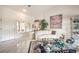 Bright living room with tile floors, a comfortable seating area, and contemporary decor at 2608 Golfside Dr, Las Vegas, NV 89134