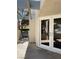 Balcony exterior featuring glass doors, pavers, and wood feature at 2761 Lodestone Dr # 63, Las Vegas, NV 89117