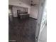 An open-plan living room and kitchen space with vaulted ceilings and modern tiled flooring at 2761 Lodestone Dr # 63, Las Vegas, NV 89117