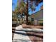 Outdoor walkway featuring well-maintained landscaping, sidewalk, and pergola on a sunny day at 2761 Lodestone Dr # 63, Las Vegas, NV 89117