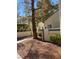 Outdoor walkway featuring well-maintained landscaping, sidewalk, and pergola on a sunny day at 2761 Lodestone Dr # 63, Las Vegas, NV 89117