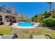 Expansive backyard with a pool, hot tub, and landscaped areas, perfect for outdoor entertaining at 2813 Via Avanti St, Henderson, NV 89074