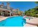 Spacious backyard featuring a sparkling pool and spa, surrounded by lush landscaping and relaxation areas at 2813 Via Avanti St, Henderson, NV 89074