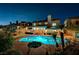 Lush backyard with a heated pool, hot tub, and mature trees at 2813 Via Avanti St, Henderson, NV 89074