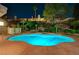 Tranquil backyard featuring a sparkling pool, lush landscaping, and privacy at 2813 Via Avanti St, Henderson, NV 89074