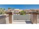 Cozy balcony overlooking the neighborhood's street and nearby houses in a lush, tropical environment at 2813 Via Avanti St, Henderson, NV 89074
