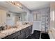 Bathroom featuring a granite countertop, modern fixtures, and a spacious bathtub at 2813 Via Avanti St, Henderson, NV 89074
