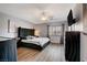Bedroom features a stylish black bedframe, contemporary decor, and a ceiling fan at 2813 Via Avanti St, Henderson, NV 89074