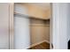 Walk-in closet with simple rod shelving and ample storage space at 2813 Via Avanti St, Henderson, NV 89074