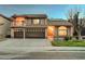 Charming two-story home with desert landscaping, three-car garage, second story balcony, and a tiled roof at 2813 Via Avanti St, Henderson, NV 89074