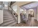 Open staircase with modern railing and an inviting sitting bench at the base at 2813 Via Avanti St, Henderson, NV 89074