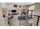 Cozy living room with brick fireplace, open floor plan and access to the outdoor pool at 2813 Via Avanti St, Henderson, NV 89074
