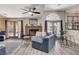 Inviting living room with brick fireplace and french doors leading to the pool at 2813 Via Avanti St, Henderson, NV 89074