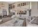 Elegant living room with high ceilings, open floor plan, modern decor, and wood flooring at 2813 Via Avanti St, Henderson, NV 89074
