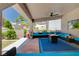 Spacious covered patio featuring comfortable lounge seating and ceiling fan for outdoor enjoyment at 2813 Via Avanti St, Henderson, NV 89074