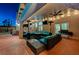 Stylish covered patio with comfortable seating, ceiling fan, and views of the backyard at 2813 Via Avanti St, Henderson, NV 89074