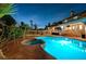 Beautiful backyard showcasing a pool, hot tub, and covered patio at 2813 Via Avanti St, Henderson, NV 89074