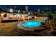 Backyard with a freeform pool, covered patio, and inviting outdoor space at 2813 Via Avanti St, Henderson, NV 89074