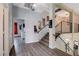 Inviting staircase with modern railings and unique wall decor leading to the upper level at 2813 Via Avanti St, Henderson, NV 89074