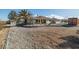 Expansive property featuring a single-story home with a covered patio and low-maintenance desert landscaping at 3330 Unicorn Ave, Pahrump, NV 89048