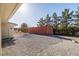 View of backyard with storage container, landscaping and access to back door at 3330 Unicorn Ave, Pahrump, NV 89048