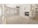 Charming living room featuring a fireplace, large windows, and modern ceiling fan at 3330 Unicorn Ave, Pahrump, NV 89048