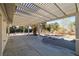 Covered patio with decorative columns offering views of the landscaped backyard at 3330 Unicorn Ave, Pahrump, NV 89048