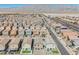 Expansive aerial view of a suburban neighborhood with mountain backdrop, showcasing community layout and residential properties at 3747 Lambent Ave, North Las Vegas, NV 89084
