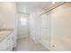 Modern bathroom featuring a spacious shower with glass doors and tiled walls at 3747 Lambent Ave, North Las Vegas, NV 89084