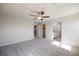 Spacious bedroom boasts neutral walls, plush carpet, and views to the bathroom and closet at 3747 Lambent Ave, North Las Vegas, NV 89084