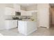 Modern kitchen features white cabinets, stainless steel appliances, and a large island at 3747 Lambent Ave, North Las Vegas, NV 89084
