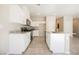 Updated kitchen with white cabinets, stainless steel appliances and granite countertops at 3747 Lambent Ave, North Las Vegas, NV 89084