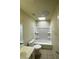 Bathroom featuring a tub-shower combo, vanity with sink, tile floor, and skylight at 3797 Monument St, Las Vegas, NV 89121