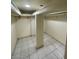 Large walk-in closet featuring tile flooring, built-in shelving, and lots of storage at 3797 Monument St, Las Vegas, NV 89121