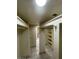 Spacious walk-in closet with ample shelving, tile floors, and neutral wall color at 3797 Monument St, Las Vegas, NV 89121